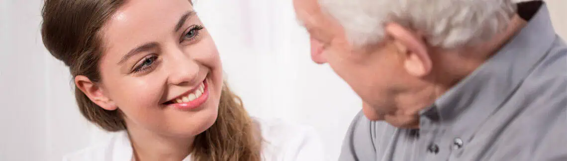 Picture,Of,Smiling,Nurse,Assisting,Senior,Man